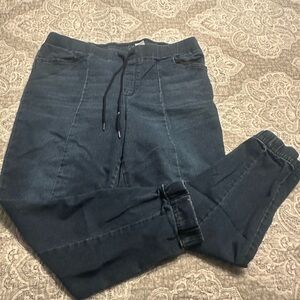 Jogger pulling on jeans